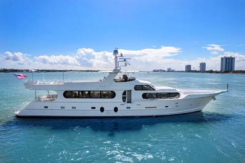 Envision, a white 110-foot Broward motor yacht, seen from the water