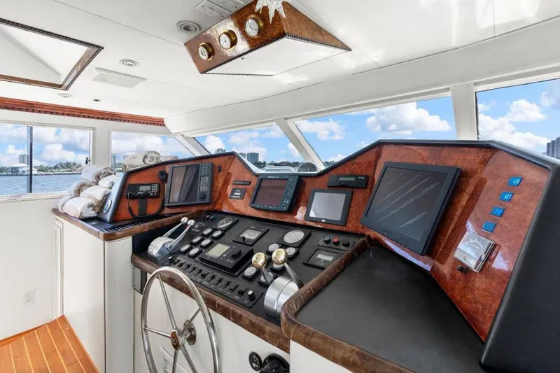 The helm aboard Envision with wood navigation consoles