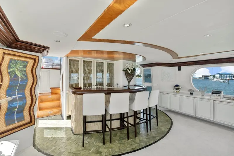 Envision's curved interior wet bar and four stools